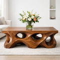 Solid Wood Coffee Table with Sculptural Hollow Base and Organic Carved Design - view 1 of 9