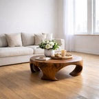 Solid Wood Round Coffee Table with Sculptural Curved Base and Organic Design - view 1 of 9