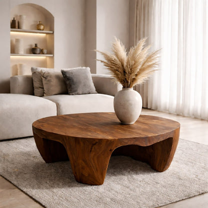 Solid Wood Round Coffee Table with Sculptural Base and Organic Carved Design - view 1 of 9