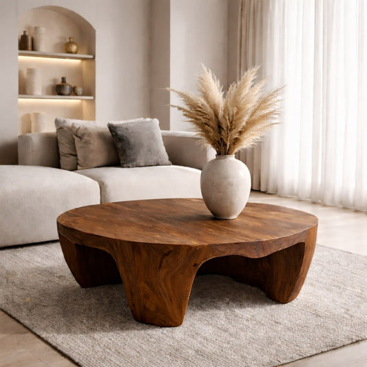 Solid Wood Round Coffee Table with Sculptural Base and Organic Carved Design - view 1 of 9